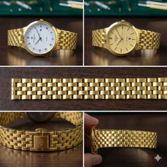 Gold watch with detailed close-ups on a wooden surface
